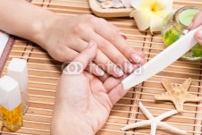 Woman_in_a_nail_salon_receiving_manicure.jpg